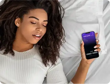Woman using NuCalm app for better sleep and stress relief