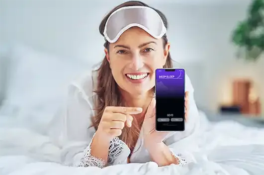 Woman using NuCalm app for relaxation and sleep